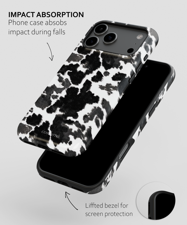Phone case with cow print design on a white background