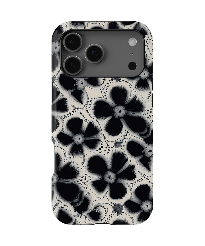 Midnight Petal phone case with black and white floral design on iPhone