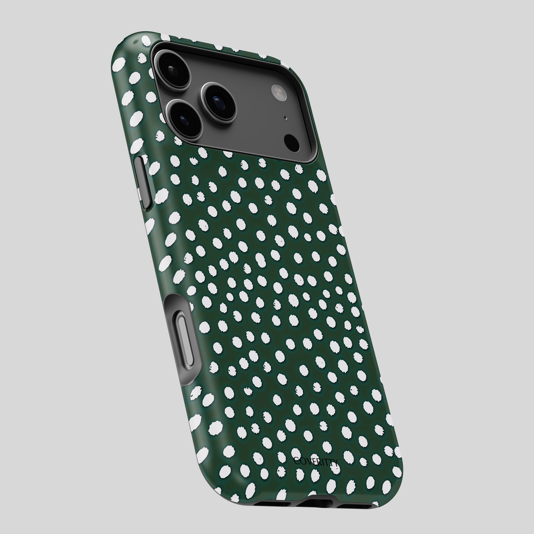 Phone case with green and white polka dot pattern on a gray background