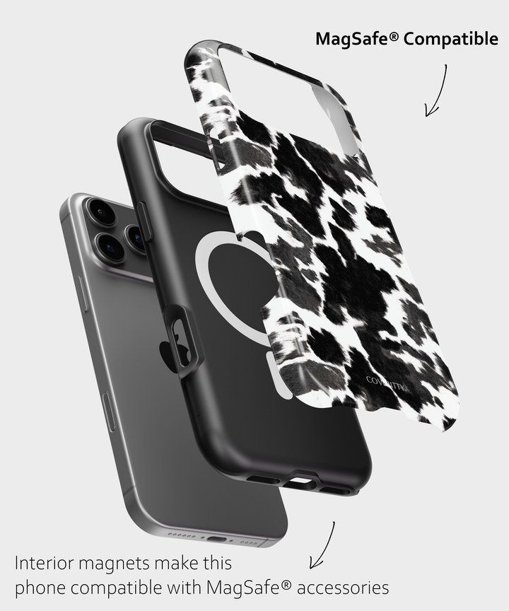 Phone case with cow print design and MagSafe compatibility text on a white background